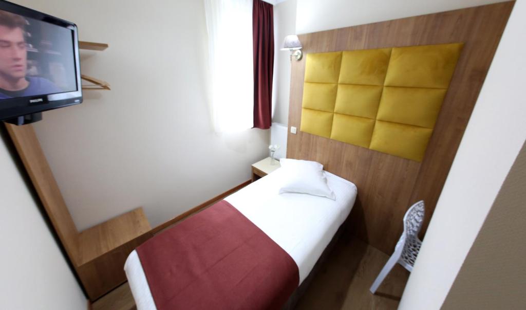 Postel nebo postele na pokoji v ubytování Sun Hotel