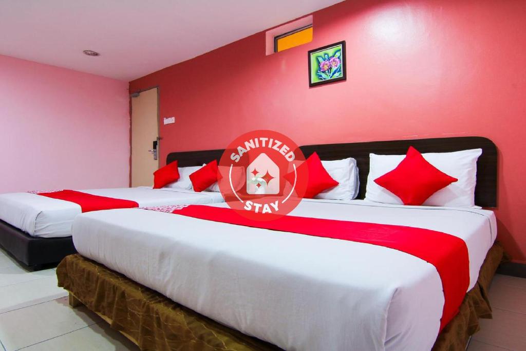 Katil atau katil-katil dalam bilik di OYO 11343 Hotel Putra Iskandar