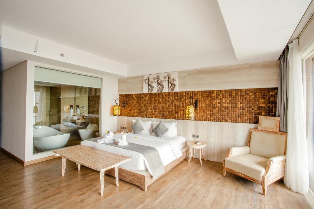 Area soggiorno di Jimbaran Bay Beach Resort and Spa by Prabhu
