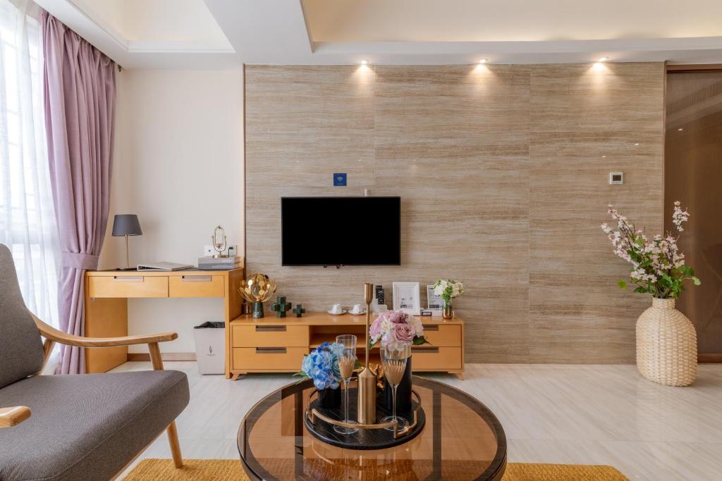 TV a/nebo společenská místnost v ubytování Dingshang Apartment Hotel