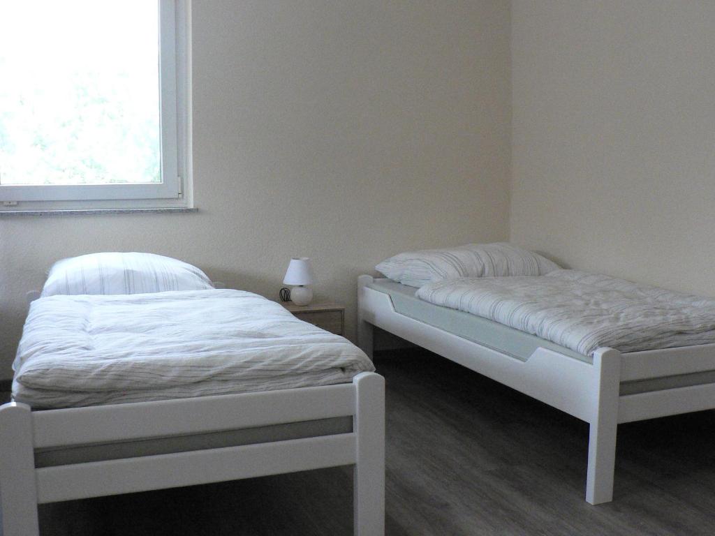 Postel nebo postele na pokoji v ubytování Gästehaus Haalck