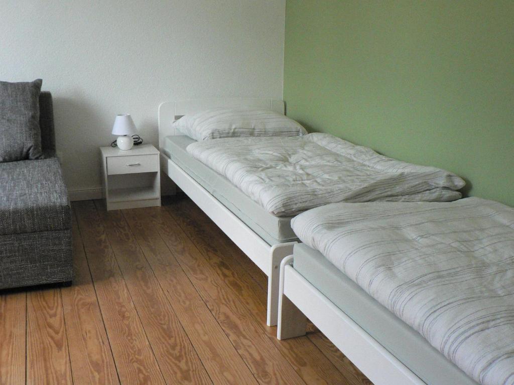 Postel nebo postele na pokoji v ubytování Gästehaus Haalck