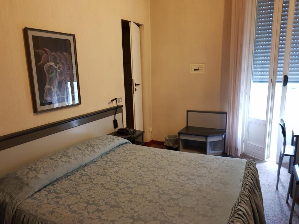 Postel nebo postele na pokoji v ubytování Hotel Ada
