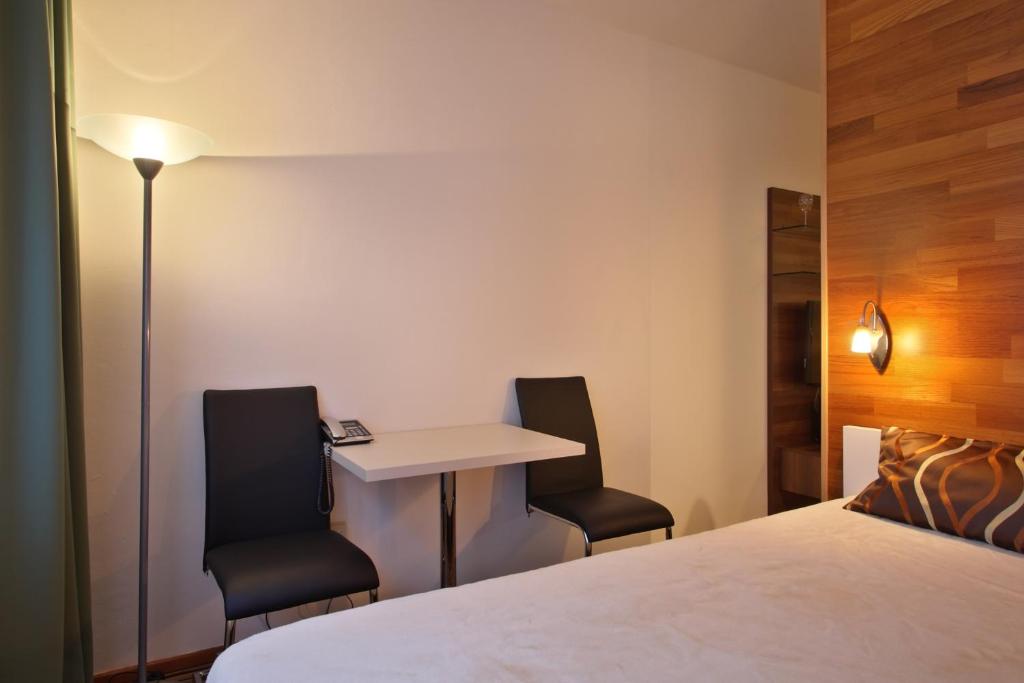 Postel nebo postele na pokoji v ubytování Apartmány Čeladná