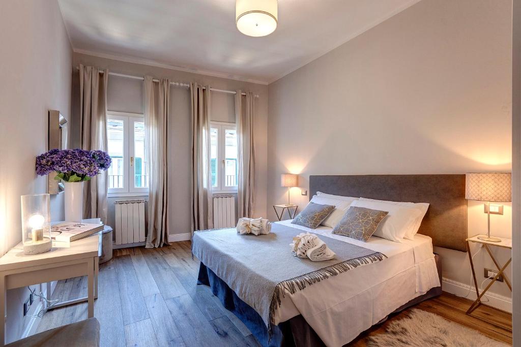 Posteľ alebo postele v izbe v ubytovaní Faenza Apartment by Mamo Florence