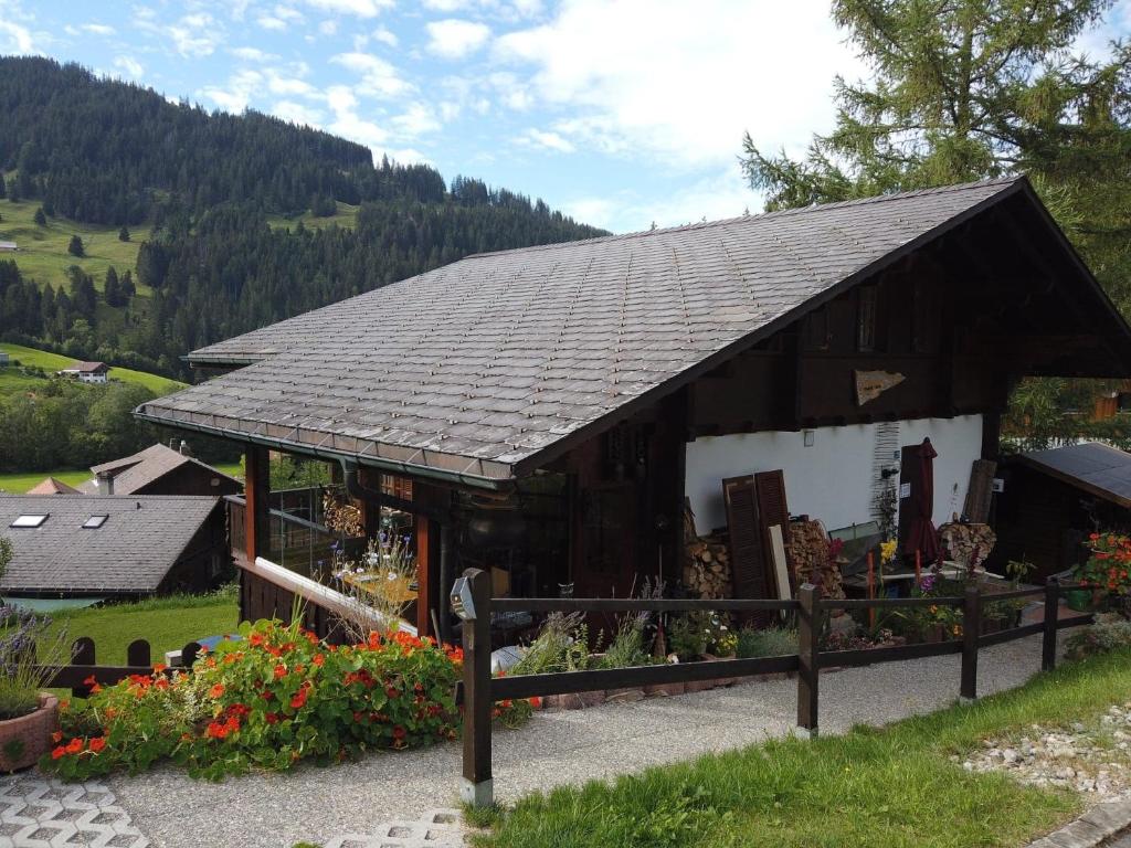 a small building with a roof on a hill at Jack in Schwarzsee