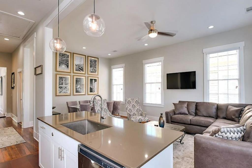 a kitchen and living room with a couch and a table at 111 Waldburg street Beautifully Renovated Historic 5 bedroom 5 bath in Savannah
