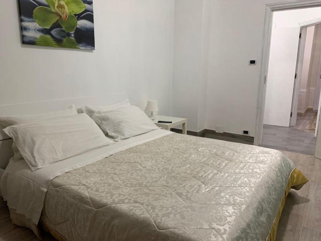 Postel nebo postele na pokoji v ubytování Palazzo Lamanna