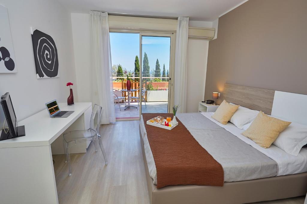 Postel nebo postele na pokoji v ubytování Hotel Bel 3