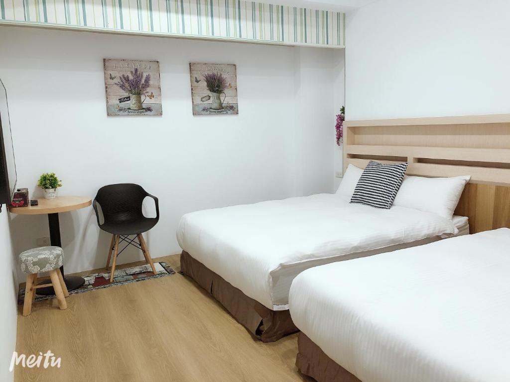 Postel nebo postele na pokoji v ubytování Penghu Little Apple B&B