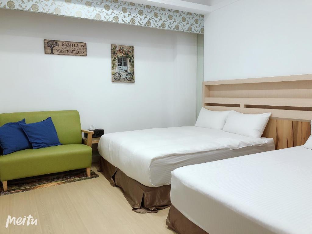 Postel nebo postele na pokoji v ubytování Penghu Little Apple B&B