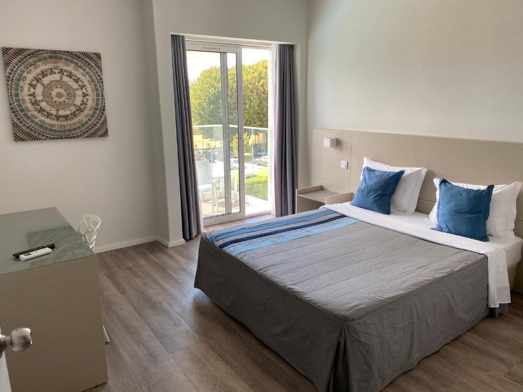 Postel nebo postele na pokoji v ubytování Hotel do Parque