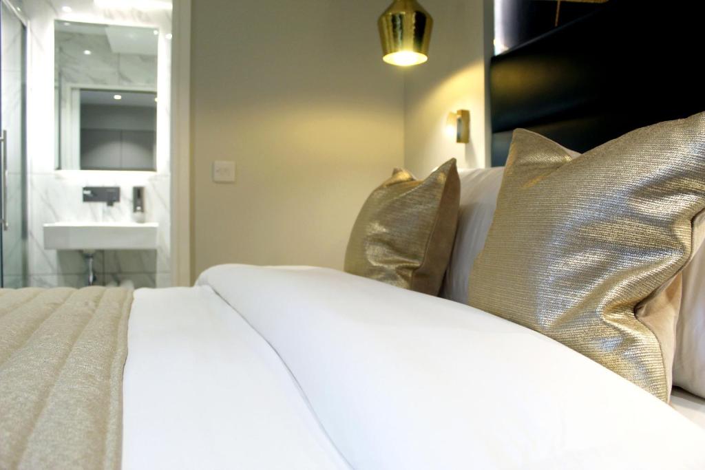 Letto o letti in una camera di NOX Waterloo