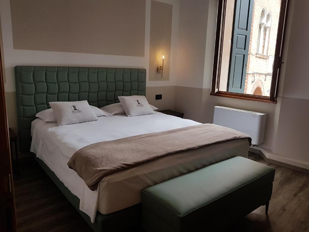 Postel nebo postele na pokoji v ubytování Hotel and Wellness Patriarca