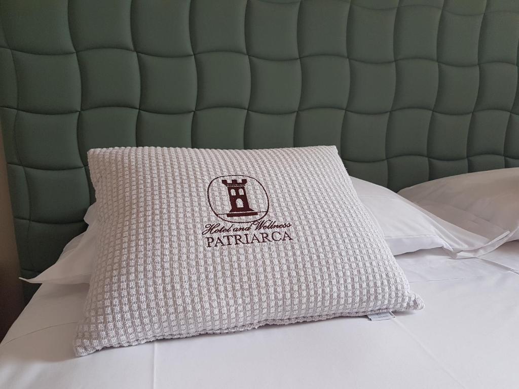 Postel nebo postele na pokoji v ubytování Hotel and Wellness Patriarca