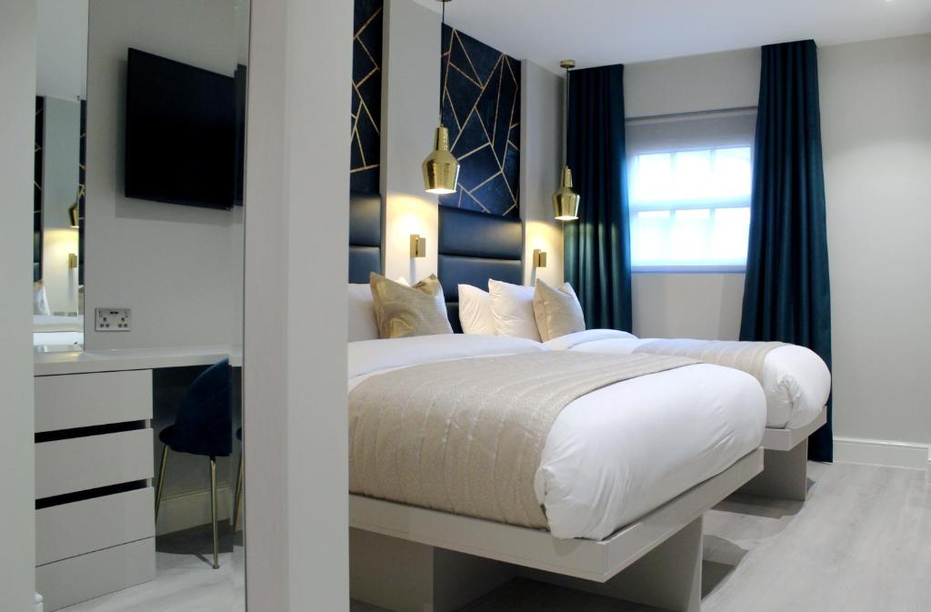 Letto o letti in una camera di NOX Waterloo