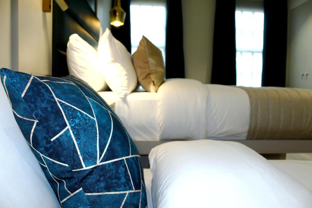 Letto o letti in una camera di NOX Waterloo
