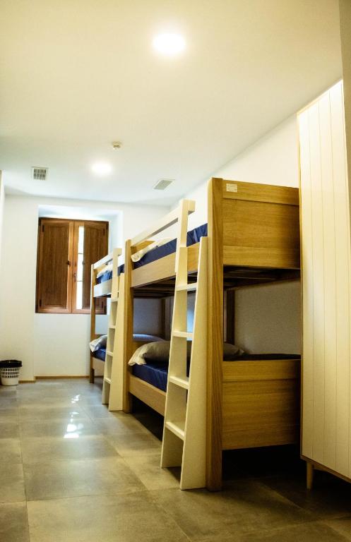 Postel nebo postele na pokoji v ubytování A Casa da Botica