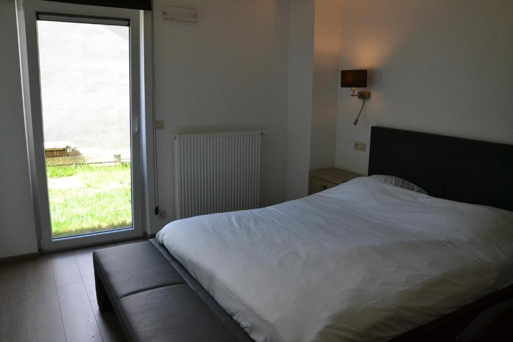 Postel nebo postele na pokoji v ubytování Auberge Le Temps des Saveurs