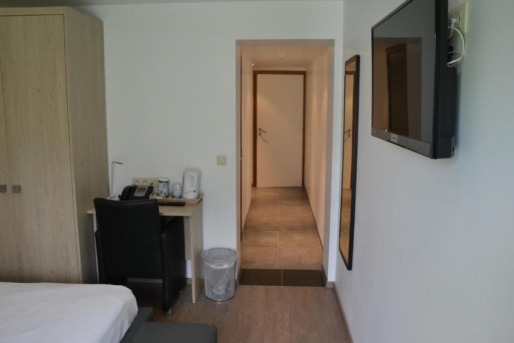Postel nebo postele na pokoji v ubytování Auberge Le Temps des Saveurs