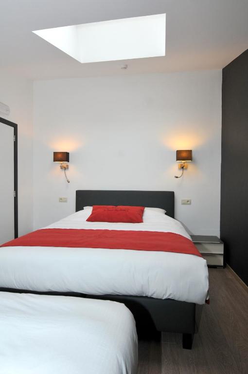 Postel nebo postele na pokoji v ubytování Auberge Le Temps des Saveurs