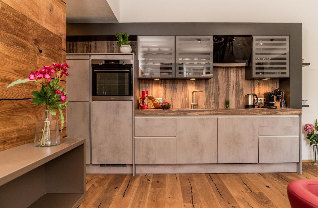 Kuchyň nebo kuchyňský kout v ubytování Apartments Greisslerei
