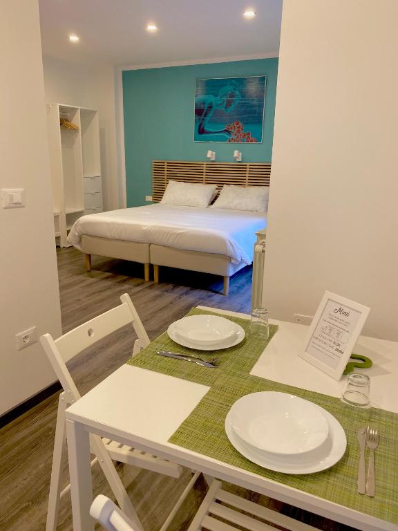 Posteľ alebo postele v izbe v ubytovaní Mimì Rooms&Studios