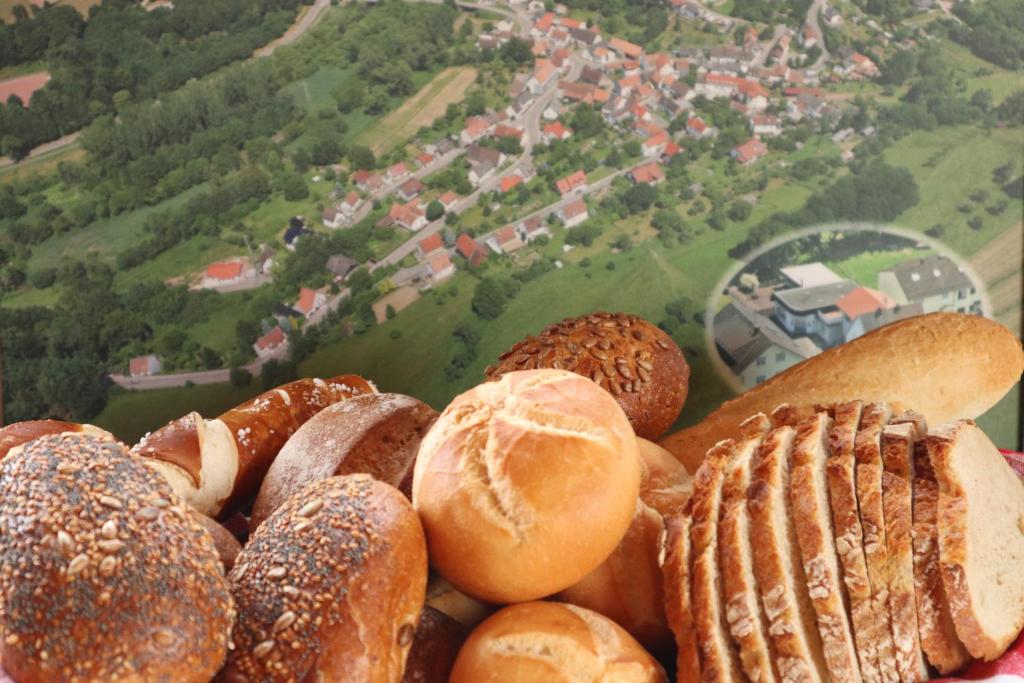 a pile of different types of breads and pastries at Pfälzer LebensArt in Rieschweiler-Mühlbach
