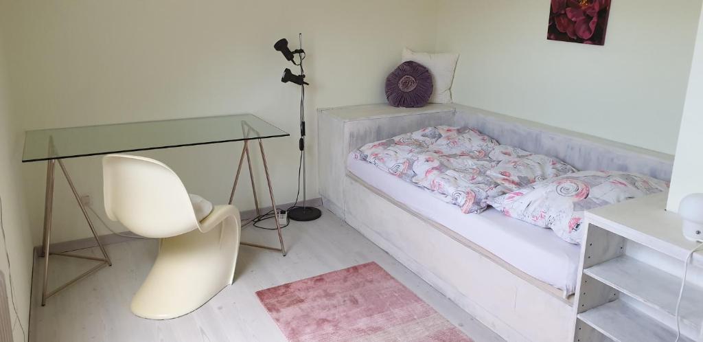 Łóżko lub łóżka w pokoju w obiekcie Ferienwohnung Donauauen