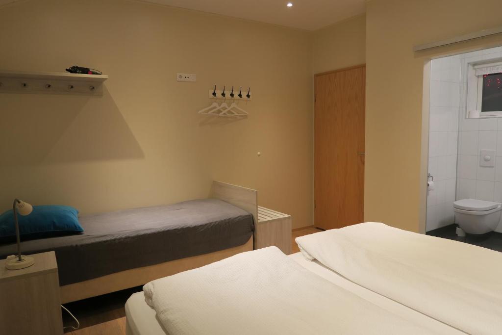 Postel nebo postele na pokoji v ubytování Dilksnes Guesthouse
