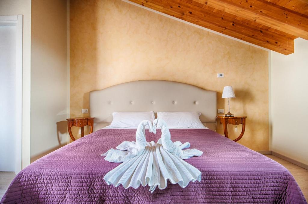 Postel nebo postele na pokoji v ubytování Lady Verona Residence