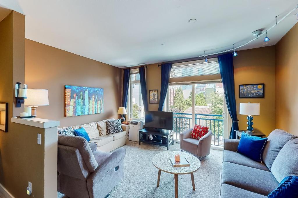 a living room with two couches and a tv at Belltown Court II in Seattle