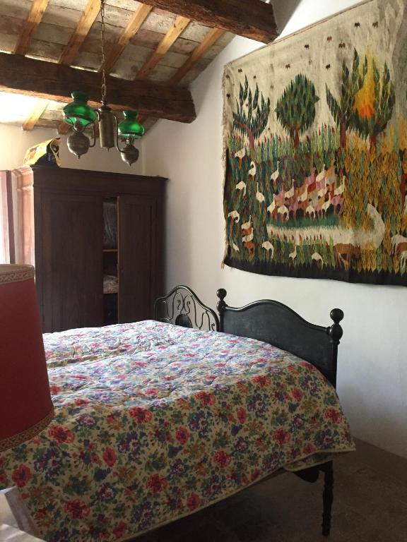 A bed or beds in a room at Casale del monte, Pesaro