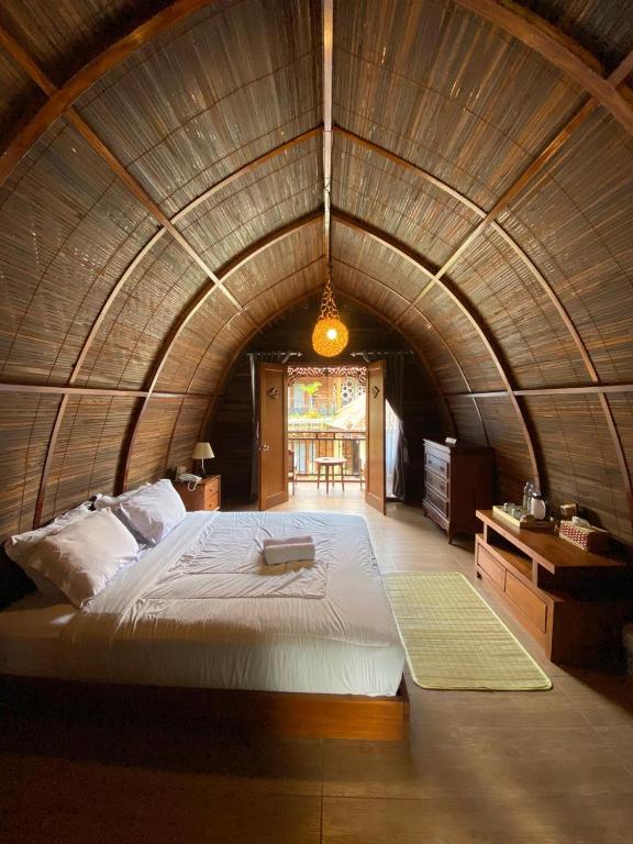 Postel nebo postele na pokoji v ubytování Khanaya Hotel Borobudur
