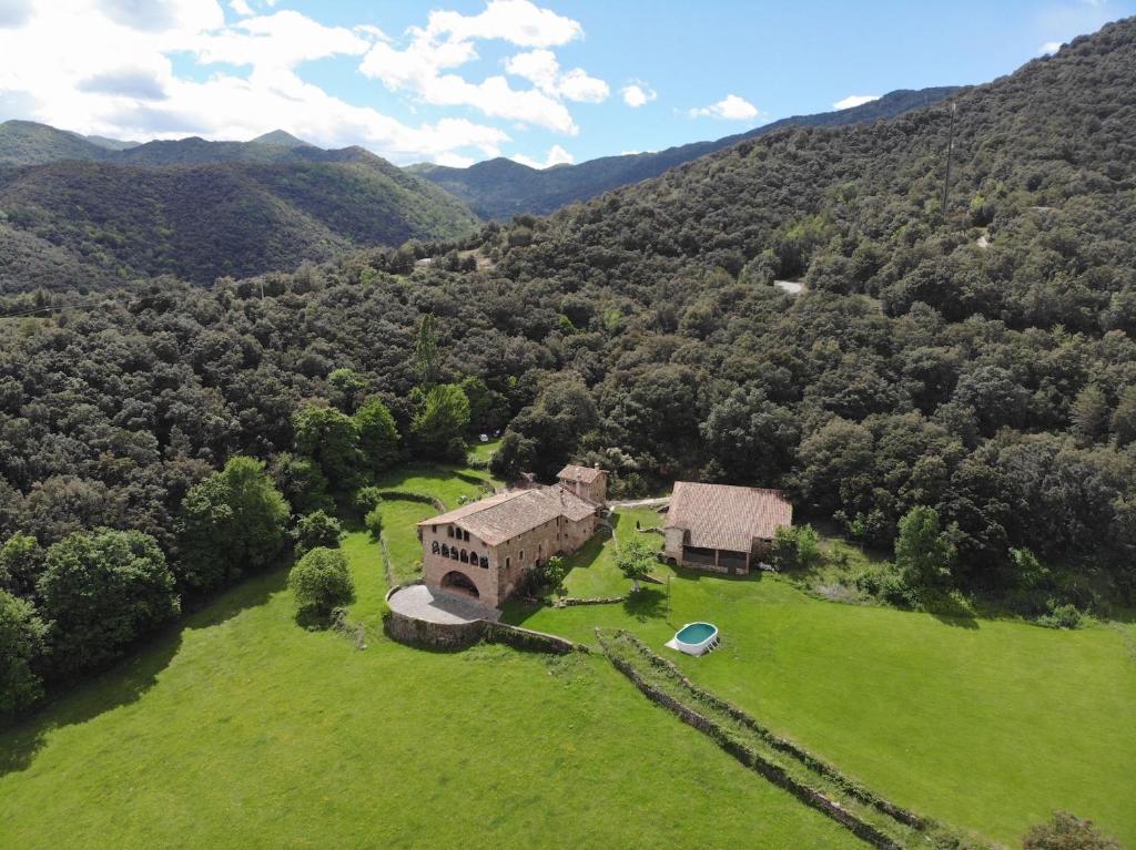 an aerial view of a house in the middle of a field at Casa Rural El Callís in Vall de Bianya