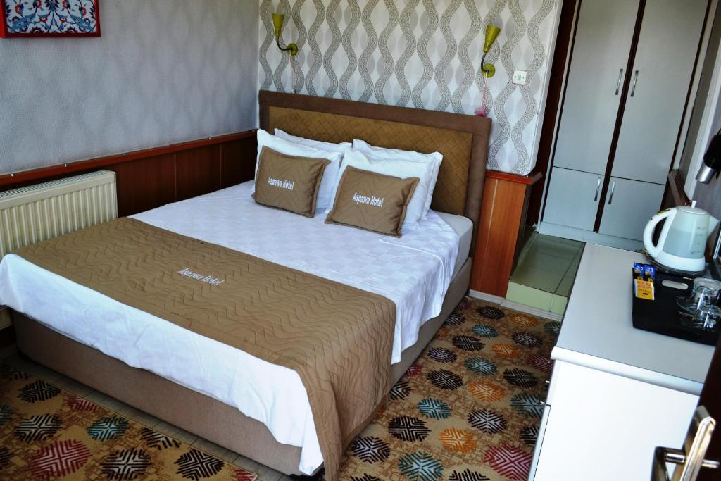 Giường trong phòng chung tại Aspawa Hotel