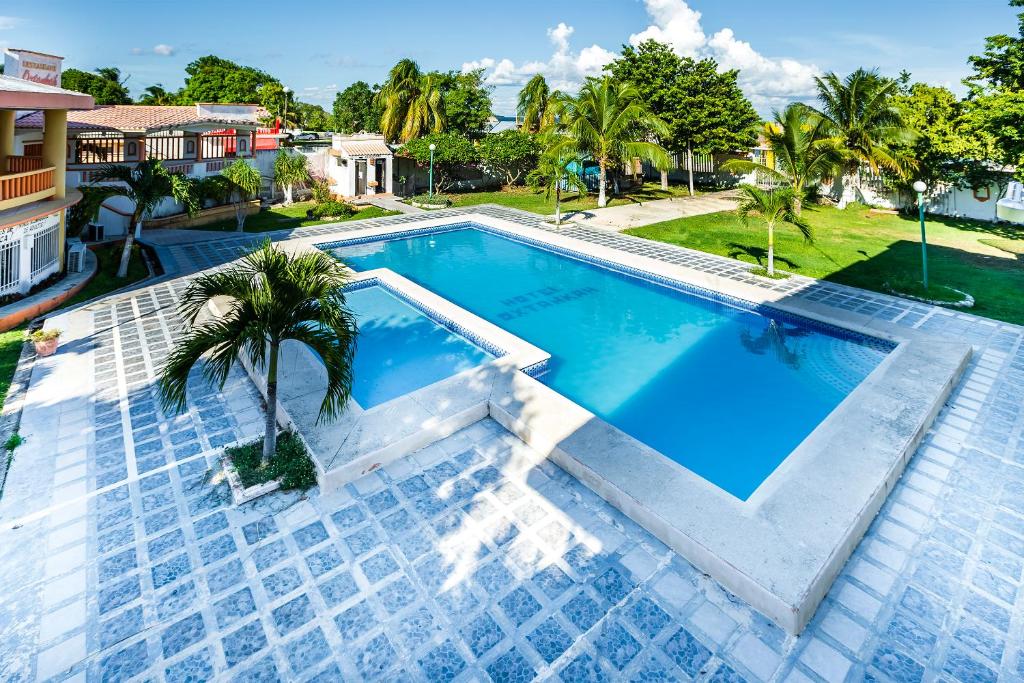 Bazén v ubytování Capital O Oxtankah,chetumal bay nebo v jeho okolí