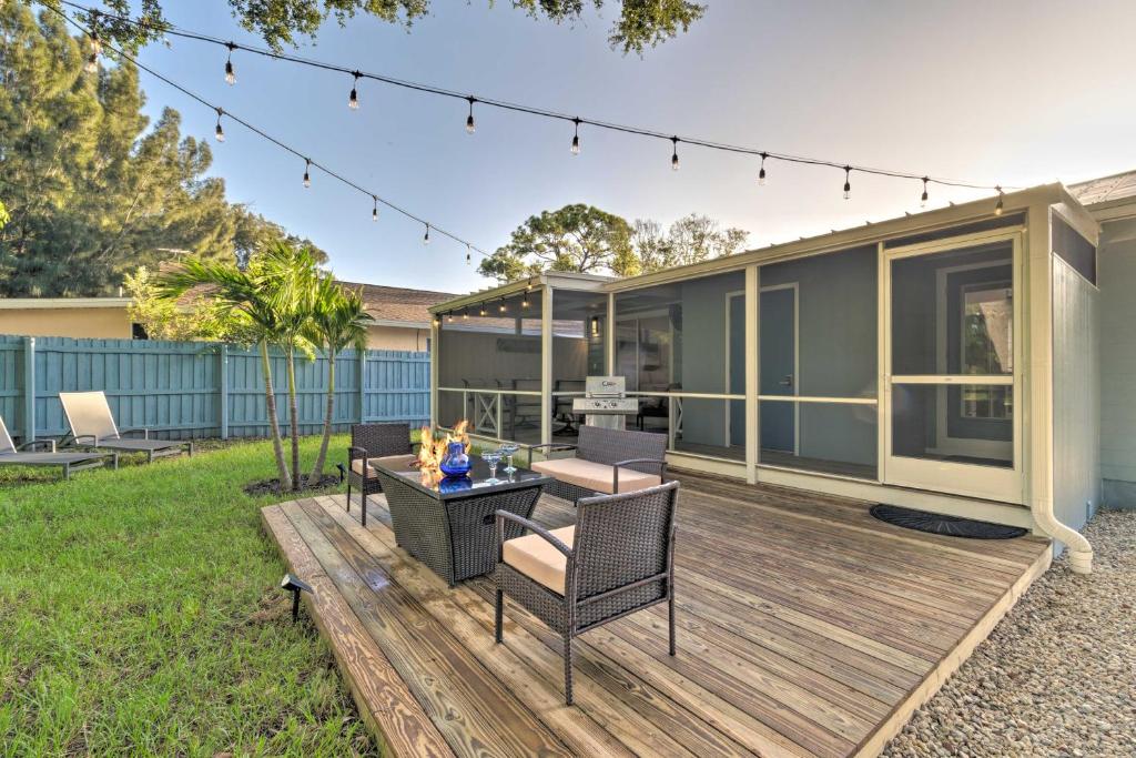 a deck with chairs and a table on a house at Charming Vacation Rental Close to Downtown! in Sarasota