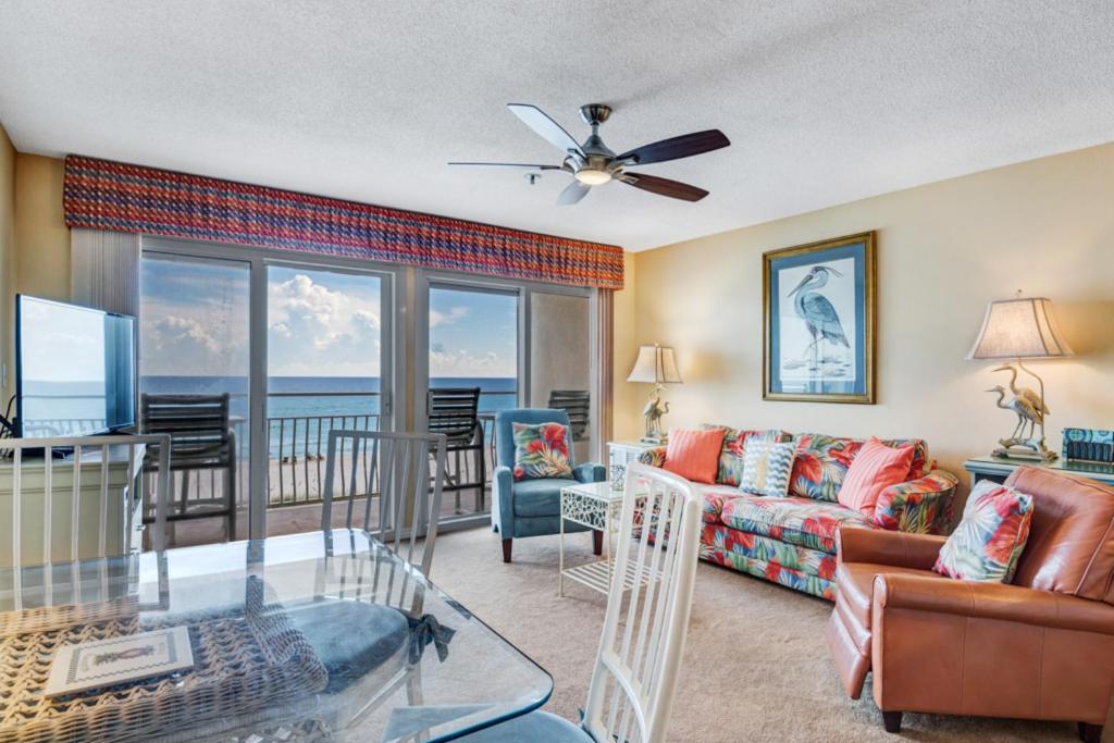 a living room with a view of the ocean at Crystal Sands III in Destin