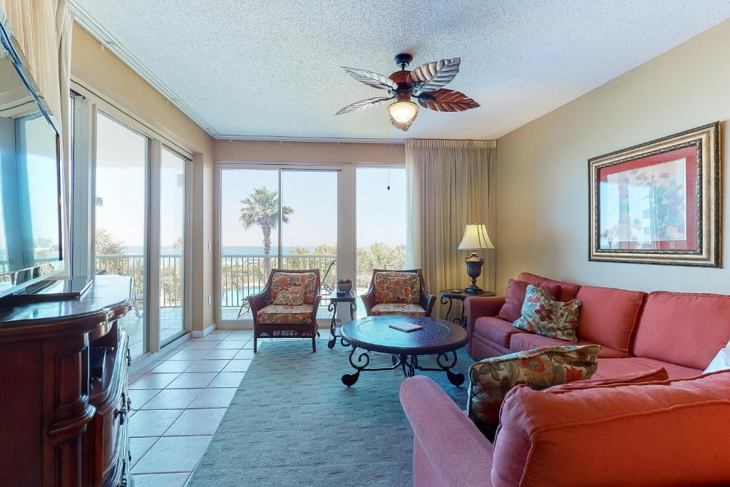 a living room with a couch and a table at Crescent II in Destin