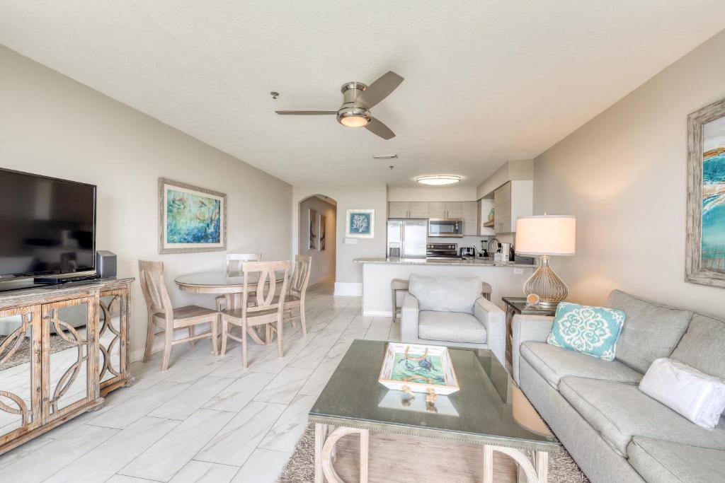 a living room with a couch and a table at Windancer Condominiums in Destin