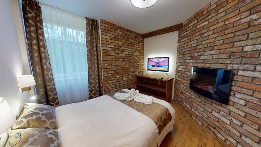 A bed or beds in a room at Apartmán Marta, 200 m Ski Tatranska Lomnica