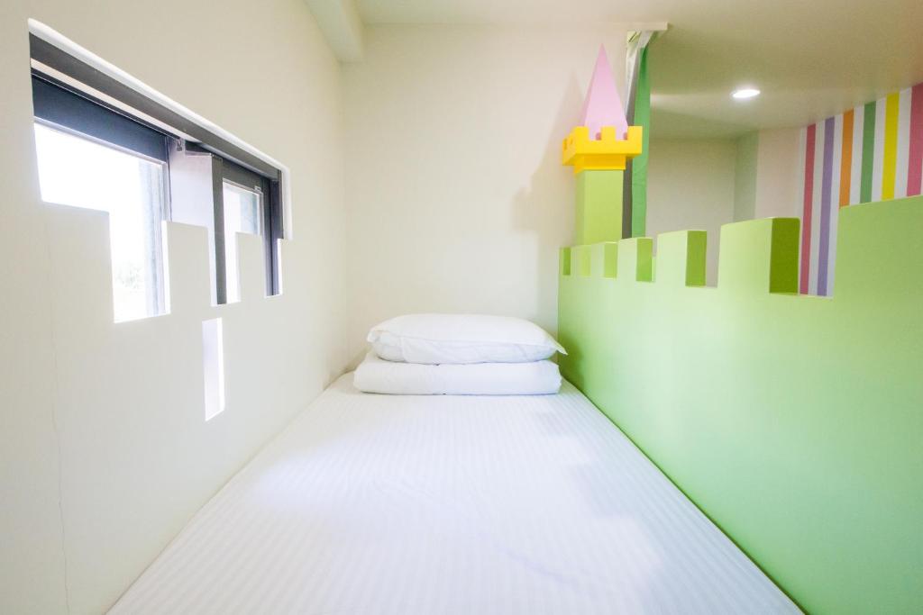 Postel nebo postele na pokoji v ubytování Kids Paradise