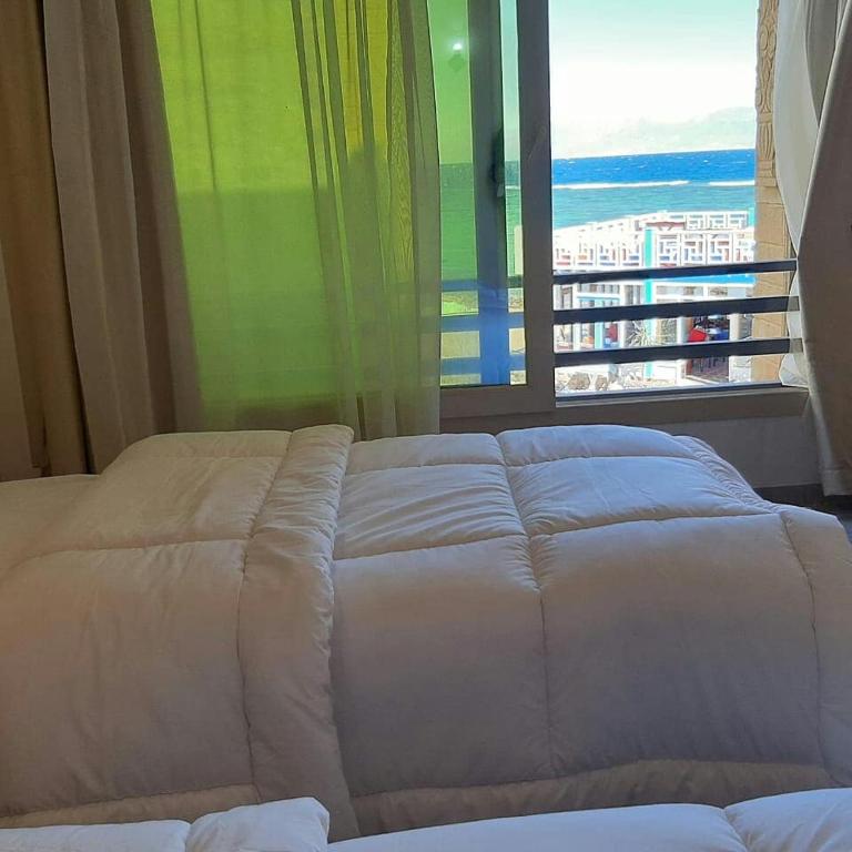 Postel nebo postele na pokoji v ubytování Diamond Dahab House