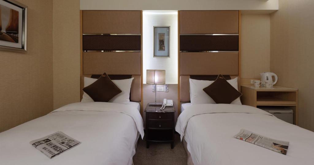 Postel nebo postele na pokoji v ubytování K Hotel Keelung