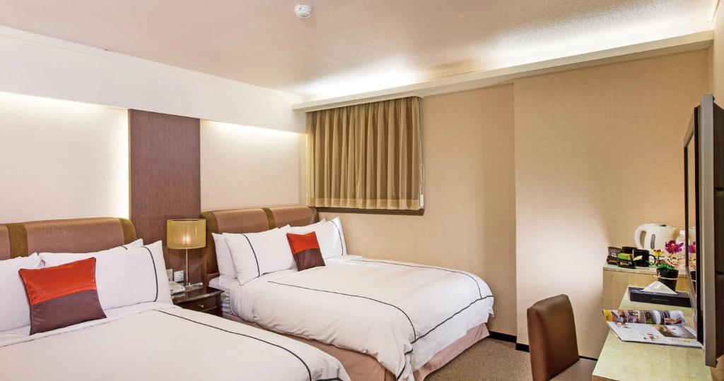 Postel nebo postele na pokoji v ubytování K Hotel Keelung