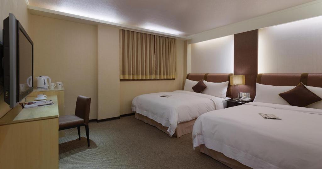 Postel nebo postele na pokoji v ubytování K Hotel Keelung