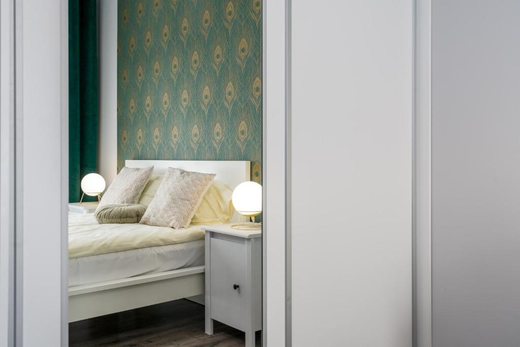 Posteľ alebo postele v izbe v ubytovaní Sleepway Apartments- Garbary 100-46