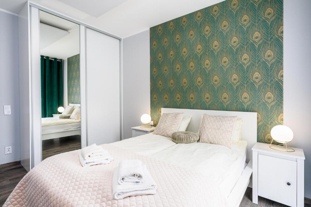 Posteľ alebo postele v izbe v ubytovaní Sleepway Apartments- Garbary 100-46