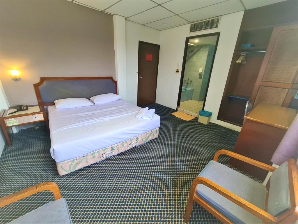 Postel nebo postele na pokoji v ubytování Anika Inn - Kluang